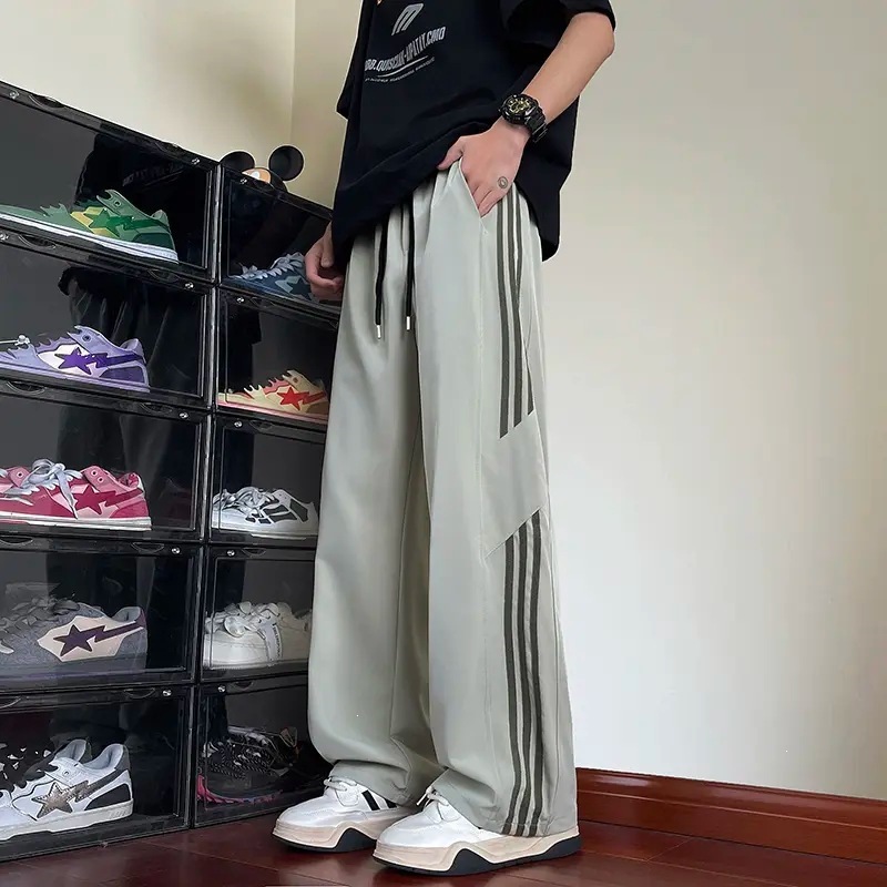 Pantalones casuales a rayas para hombres de primavera y otoño nuevos estudiantes adolescentes sueltos comercio exterior americano tres pantalones para hombres de verano