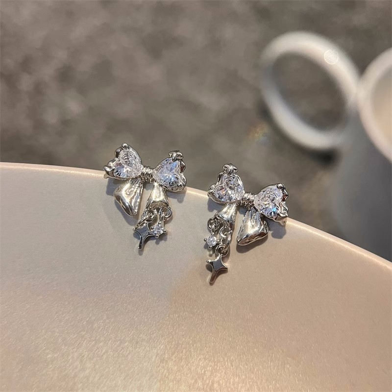 Small design fashionable earrings with bow with zircon