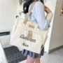 单肩多兜字母实用手提包