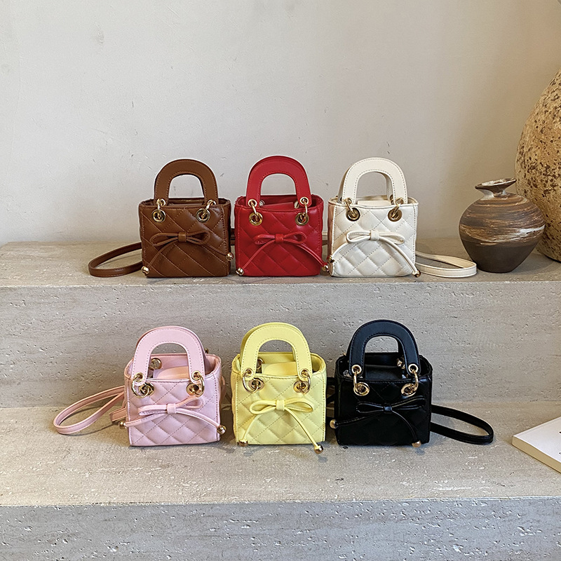 Bolsa de mano de la princesa de moda coreana Linge, lindo arco bebé bolso pequeño nuevo mini bolso de accesorios para niños