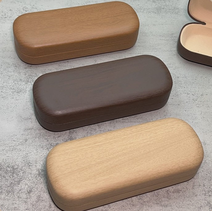 2026 nueva caja de gafas de sol de moda de cuero de dos colores bolsa blando miopía caja de ojos conjunto completo de bolsa de espejo tela
