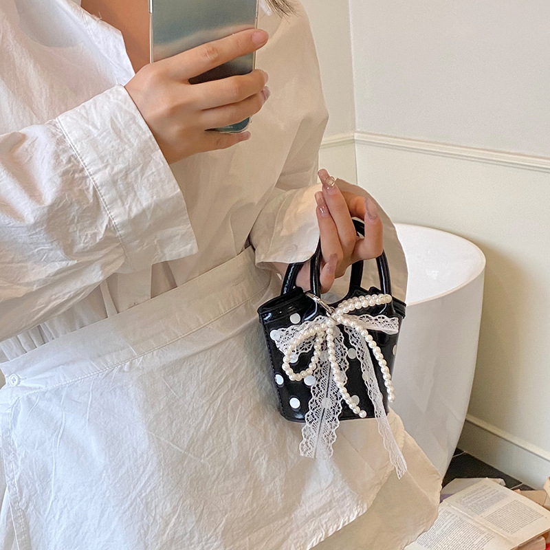 Bolso de moda coreano 2025 verano nuevo bolso femenino diseño de nicho bolso de hombro mini bolso de mensajero de lunares marea