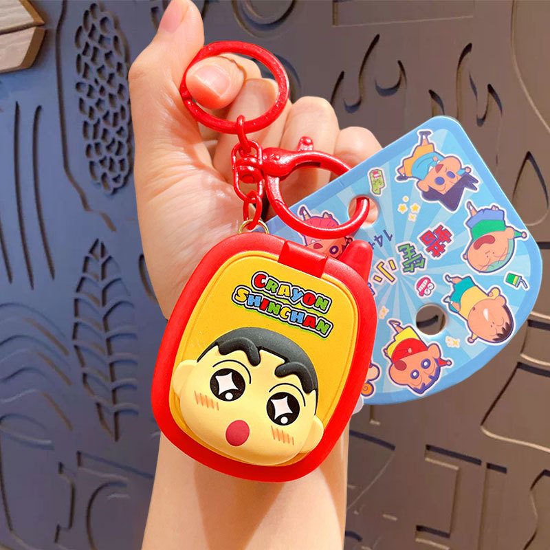 Crayons, mobile phone, game console, keychain