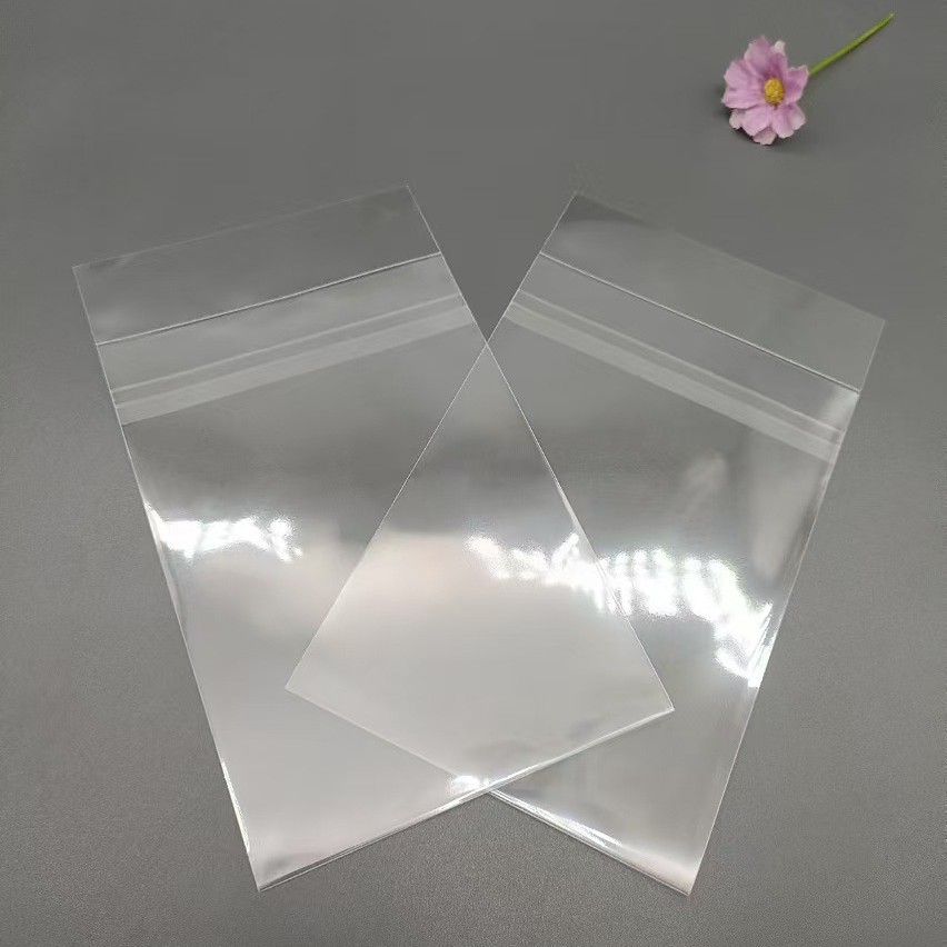 工厂热销OPP自粘袋百货小饰品包装袋透明卡通贴纸塑料包装袋不干
