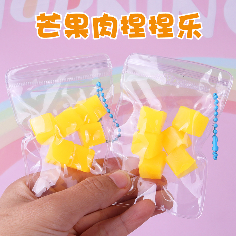 Bolsas de carne de mango, pequeños colgantes, naranja, piña, pellizcar, pellizcar, pellizcar, pellizcar, pellizcar, pellizcar, pellizcar, pellizcar, pellizcar, comer, jugar