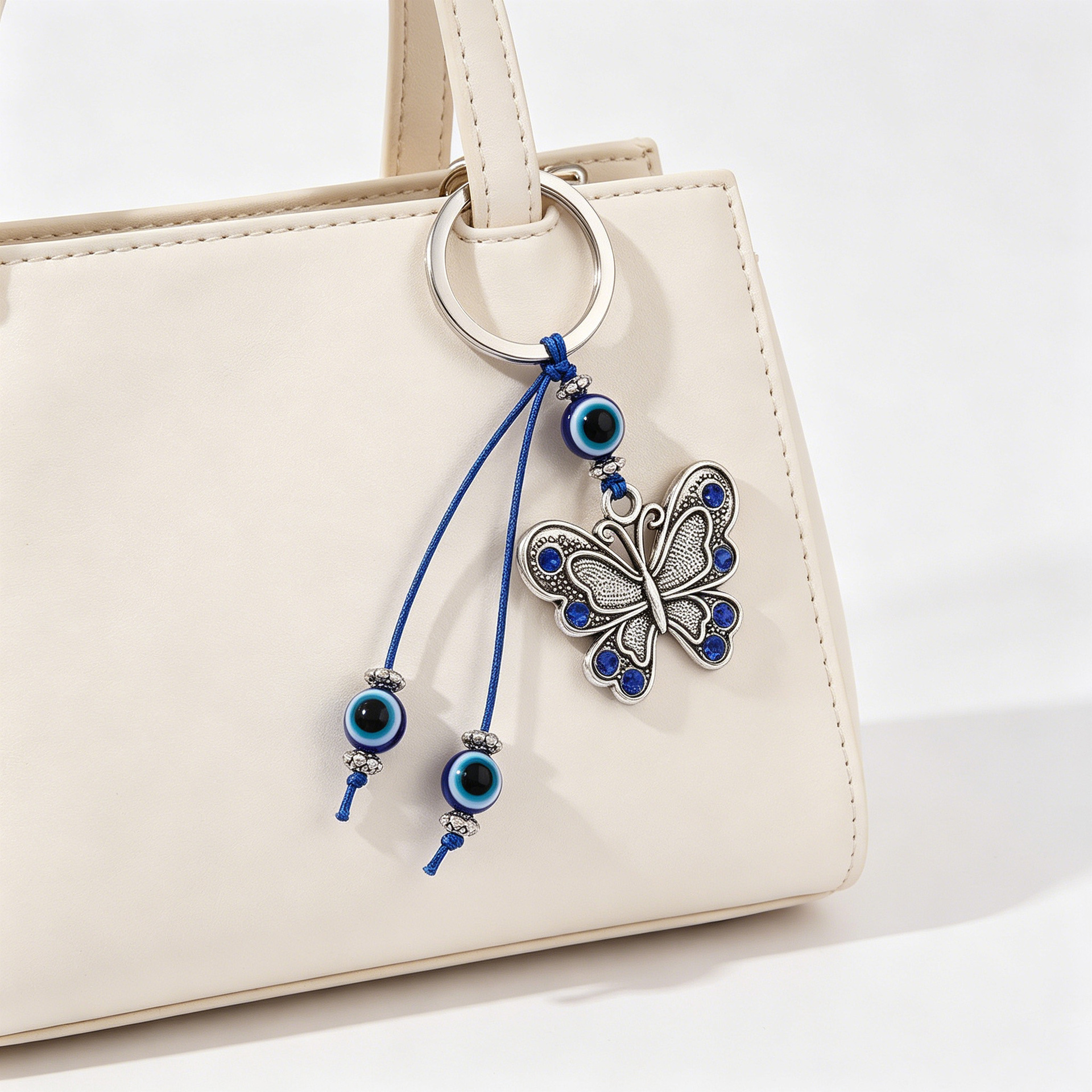 Nuevos colgantes de mariposa transfronterizos de aleación de ojos azules turcos bolsos colgantes de joyería