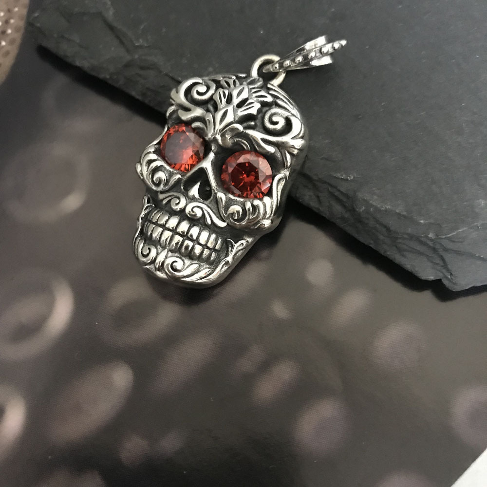 Angled view of the carved sugar skull pendant