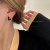 Small sophisticated fashionable black earrings, light luxury style, 2024 years