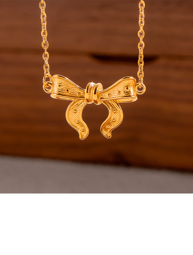 Set de joyería para mujer con colgante de lazo en acero_voghion.com