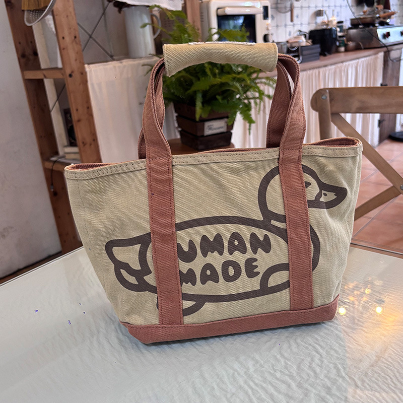 กระเป๋าโท้ท HUMAN พร้อมสต็อก ไซส์เล็ก ดีไซน์หัวใจเป็ด สไตล์ญี่ปุ่นและเกาหลี ความจุมาก กระเป๋าถือผ้าแคนวาสพิมพ์ลายเรียบง่าย