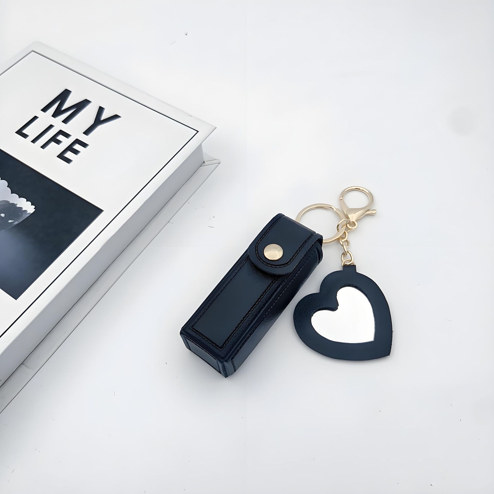 Bolso de cambio transfronterizo sobre rojo espejo creativo llavero colgante pequeño PU cuero bolso de coche accesorios accesorios en stock