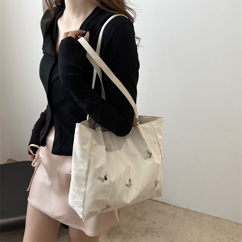 Bolso de viaje popular de gran capacidad de este año 2024 nuevo arco de moda bolso de hombro de mujer bolso universal