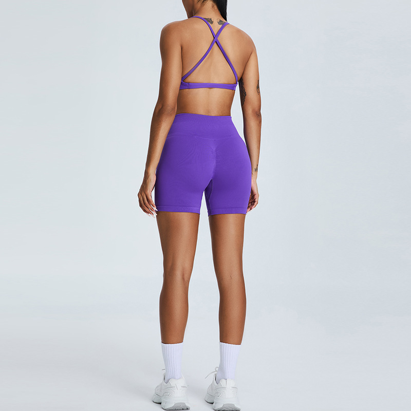 Nuevo traje de yoga sin costuras europeo y americano, pantalones cortos de yoga de cadera de melocotón para mujer, traje deportivo de carrera de espalda cruzada