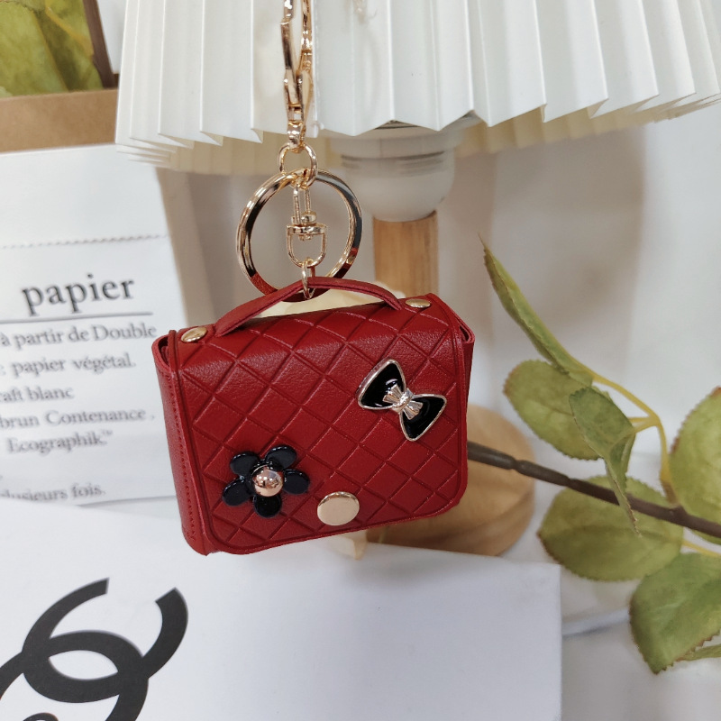 Nuevo estilo transfronterizo, moderno y exclusivo mini bolso acolchado tipo colgante, monedero para llaves, accesorio para auriculares.