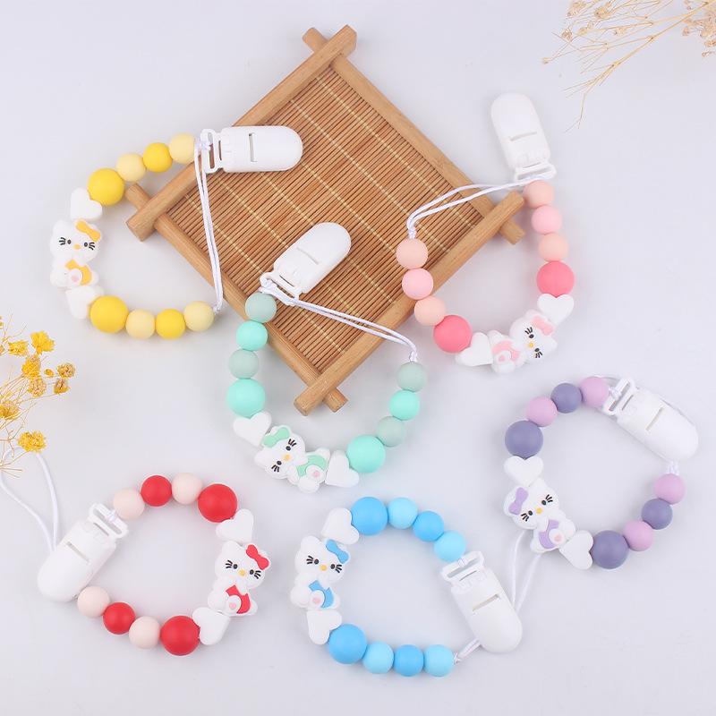 Nuevo KT gatos niños de silicona chupeta clips cadena bebé mordida cadena de dientes molares cadena anti-caída cadena pacificadora chupeta de goma de dente
