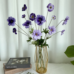 Decorating the living room with Meili orchid peony artificial flowers, setting up a TV stand and dining table, silk plastic peony from a dry generation factory.