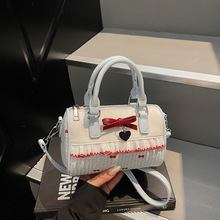 韩版时尚百搭蝴蝶结简约手拎包包女2025夏季新款高级感斜挎圆筒包