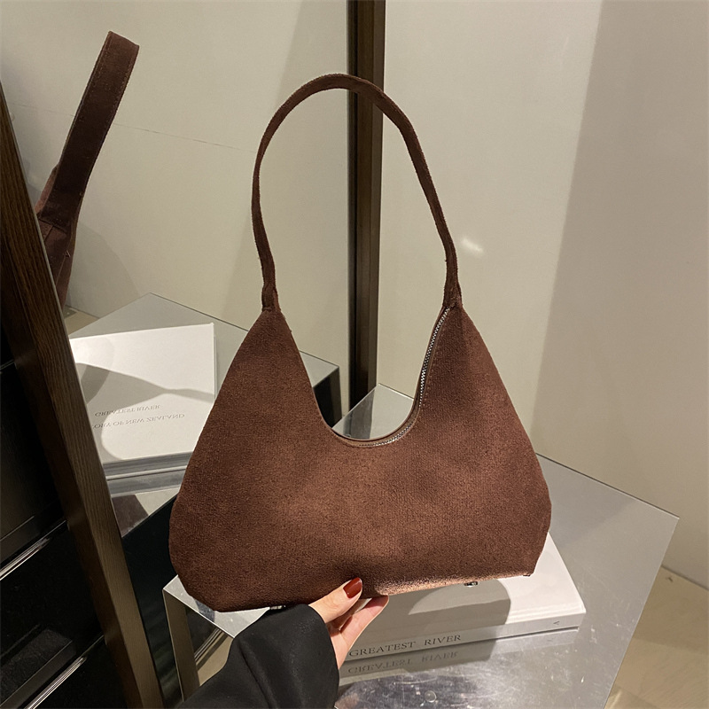 Bolsa de mano de textura retro coreana para mujeres 2025 primavera nuevo estilo de viaje al trabajo molido bolso de hombro axilla