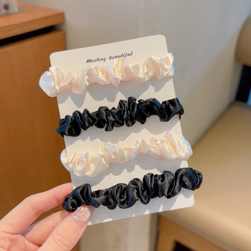 4 ¿ 4 anillos de pelo grueso negros, lechosos y blancos