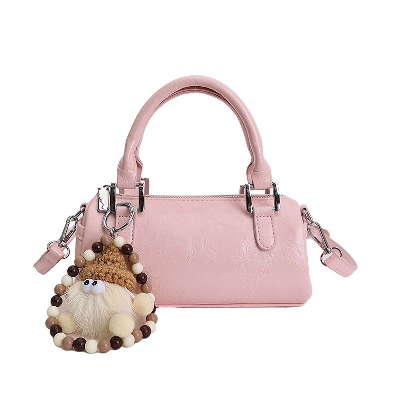 Nicho de diseño retro bolso de mano mujer 2026 primavera nuevo bolso de hombro sensación diaria de moda oblicuo bolso cilíndrico