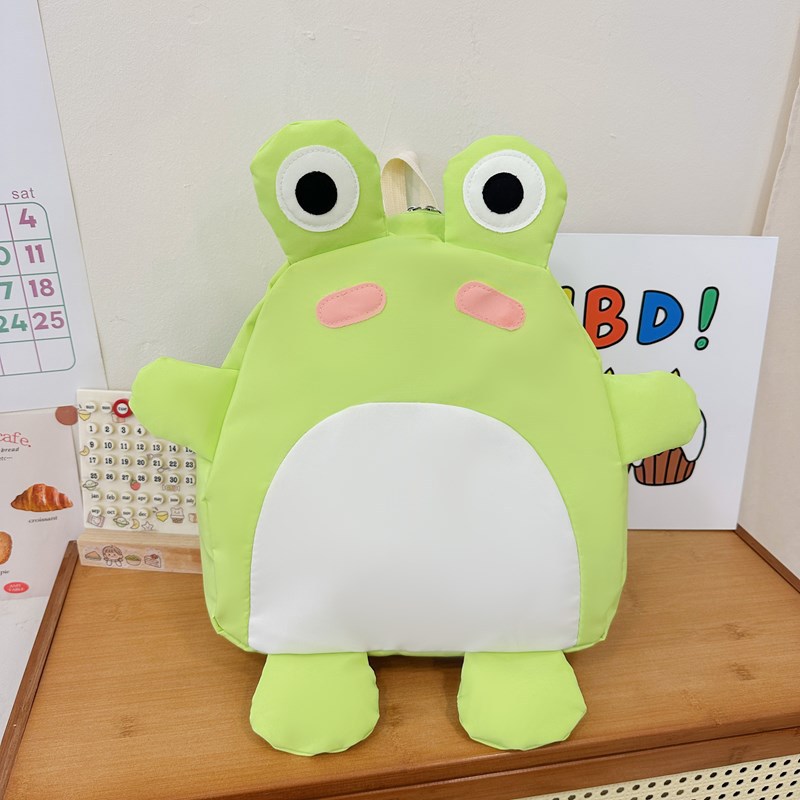 2025 nuevo bolso infantil de color de contraste cariñoso caricatura mochila de estudiantes de primaria linda forma de rana mochila para niños y niñas