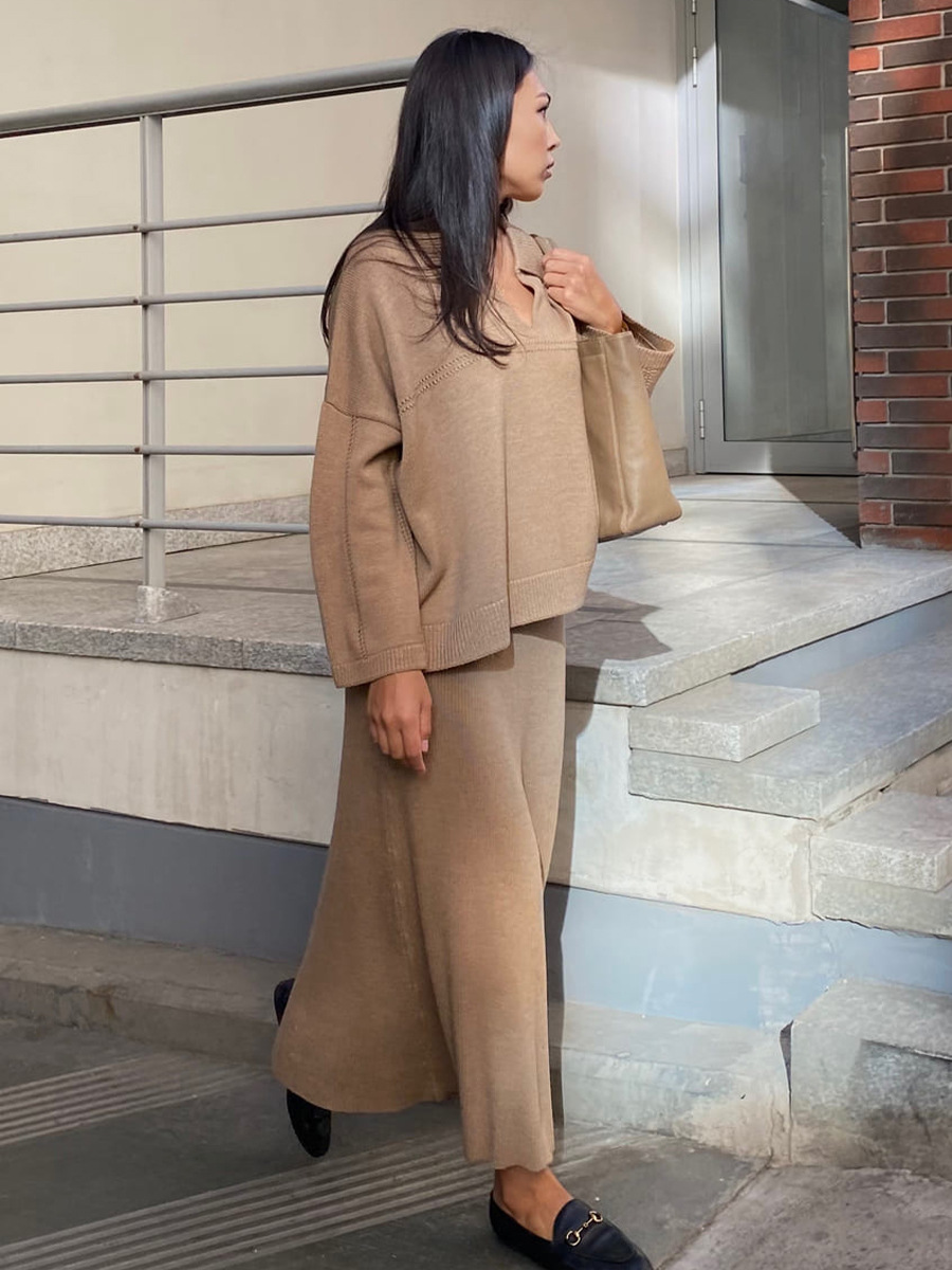 Conjunto de punto transfronterizo Europa y los Estados Unidos 2025 invierno nuevo estilo de moda minimalista viento suéter de punto de cuello V conjunto de falda de busto