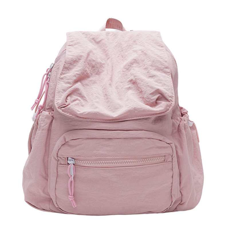 2024 nueva mochila casual de nailon, mochila escolar pequeña de color sólido de viaje coreano, bolsa de clase ligera de gran capacidad y versátil