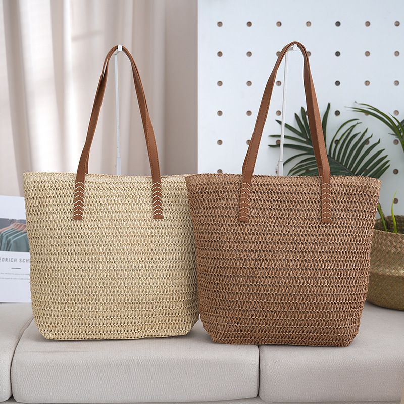 Bolsa de paja estilo de vacaciones bolsa tejida de verano modelo femenino 2025 de gran capacidad para ir al trabajo y a la escuela bolsa de viaje al por mayor