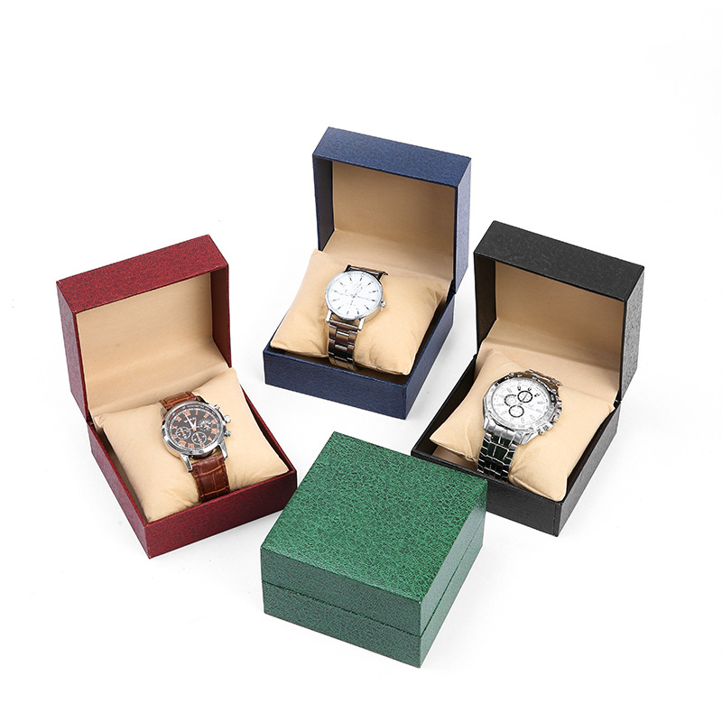 Nueva caja de exhibición de reloj con patrón de lichi con tapa abatible de alta gama, caja de embalaje de reloj de almohada de regalo de vacaciones, caja de almacenamiento al por mayor