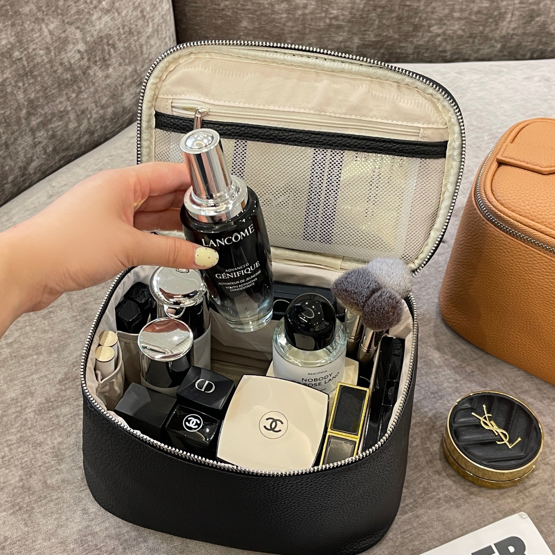 Nueva bolsa de maquillaje litchi mujer portátil de gran capacidad 2025 nueva sensación de alta calidad de viaje portátil bolsa de almacenamiento impermeable