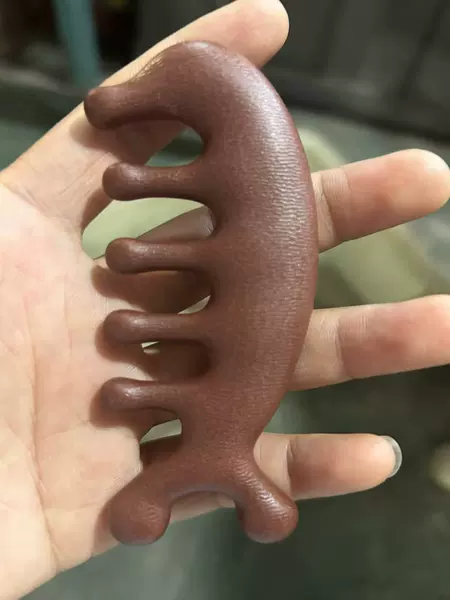 Dolphin massage comb [textured resin material]