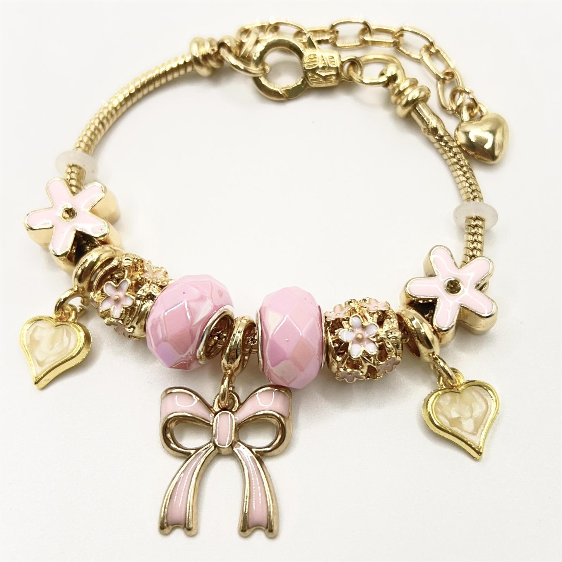 春夏の新型の小清新で甘い少女風のストライプの花の愛の蝶の数珠のブレスレットの透かし彫りのダイヤモンドの手の串