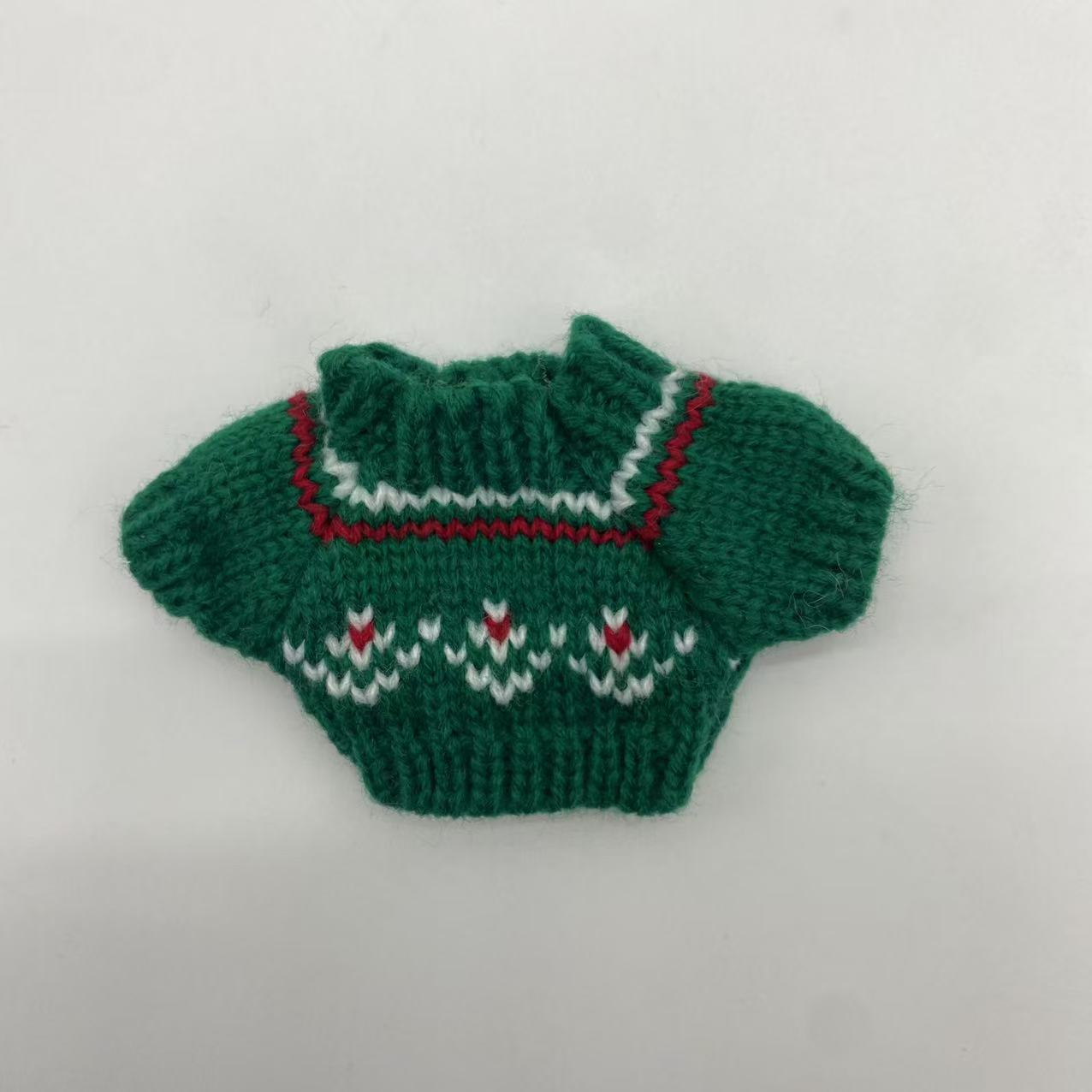 Green sweater red and white pattern