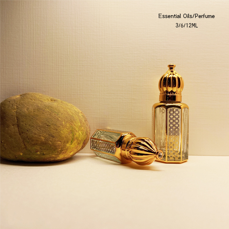 Dubai Perfume Aceite Esencial sub-botella artificial cristal artesanía metal transparente botella de perfume de vidrio dorado al por mayor