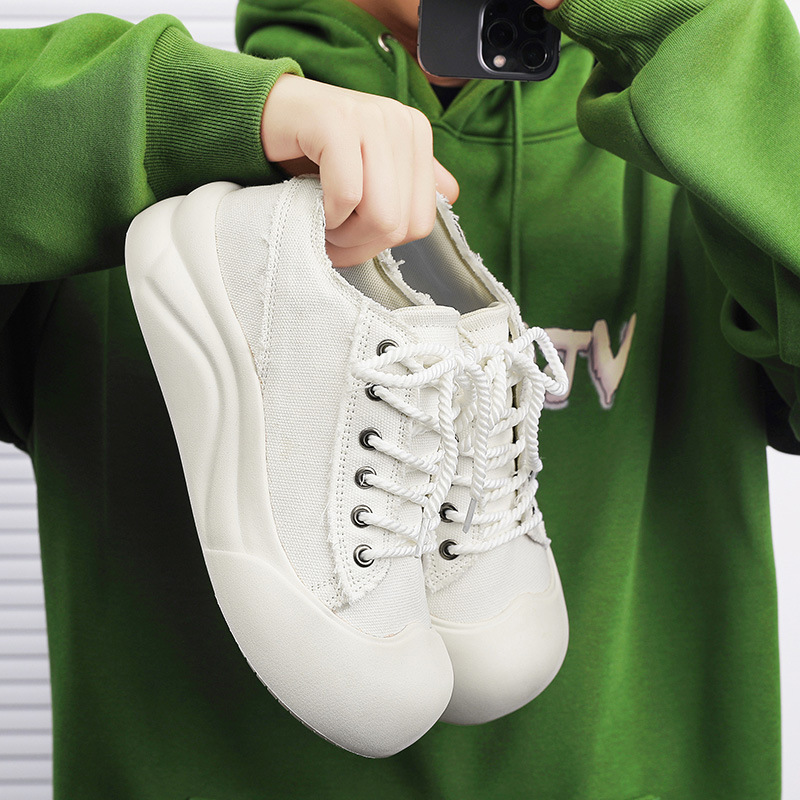 Diseño de nicho pareja zapatos de lona de cabeza grande suela gruesa zapatos casuales de todo fósforo otoño al aire libre zapatos de skate de moda coreana