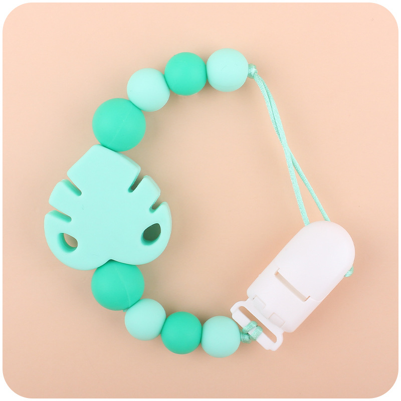 Suministros para bebés chupete cadena creativa bebé dibujos animados hojas silicona mordedura cadena anti-gota molar Nuevo