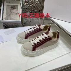 ヨーロッパの商品2025春秋の丸い頭のひもの低い運動の板の靴の本革の百合の色のカジュアルな白い靴の女性