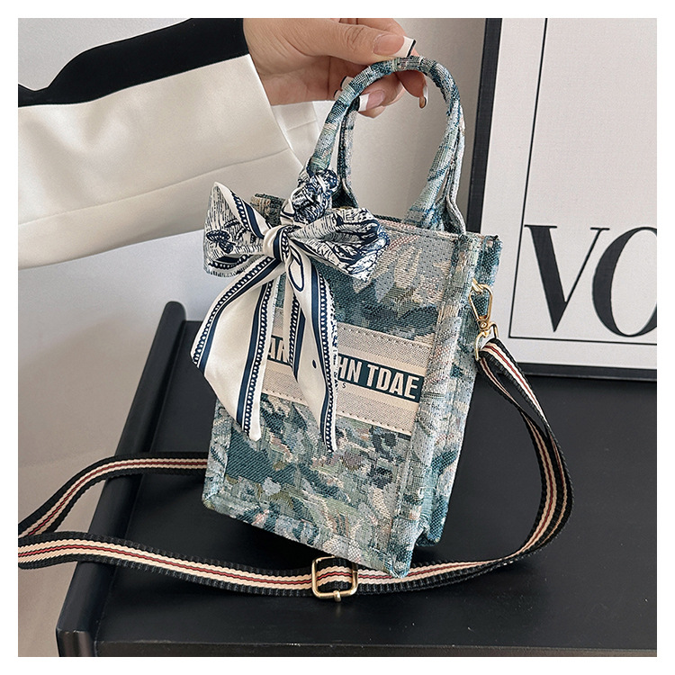 Bolso pequeño para mujer, nuevo bolso de mano vertical personalizado de moda europea y americana, bolso cruzado con estampado de lona de nicho