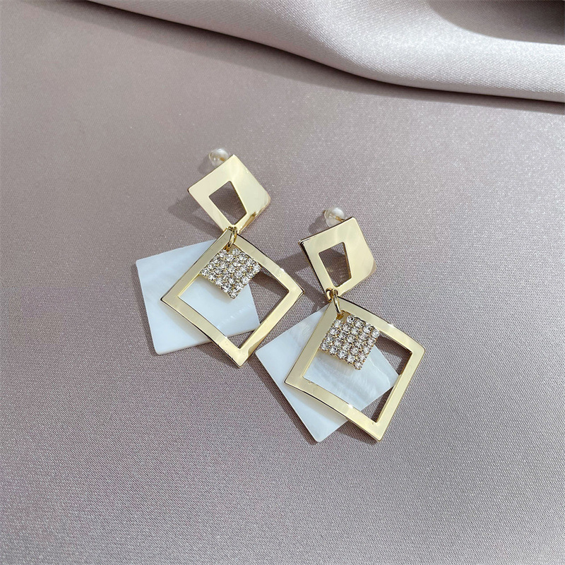 Fashion Geometric New Metal Hollow Inlaid Rhinestone Earrings display picture 3