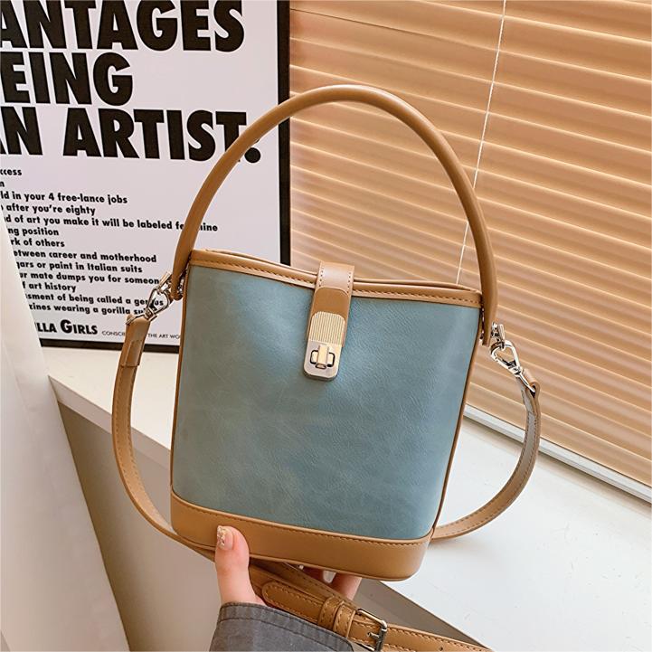 Bolsa de mano coreana de nicho universal, dama 2024 nuevo bolso de hombro, bolso de cubo de moda de alta calidad