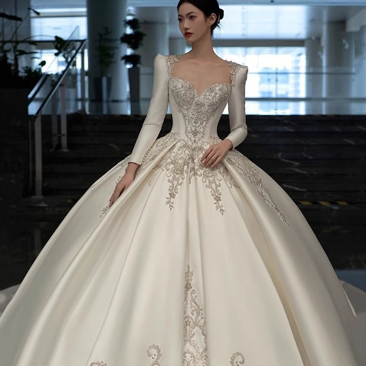 Vestido de novia de satén texturizado de alta gama, estilo invierno 2026, de manga larga, estilo princesa, con cola, de lujo, estilo francés.