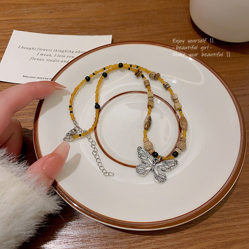 Bohemian-style butterfly necklace for women, featuring a new Chinese retro bead sweater vest chain, a niche temperament necklace.
