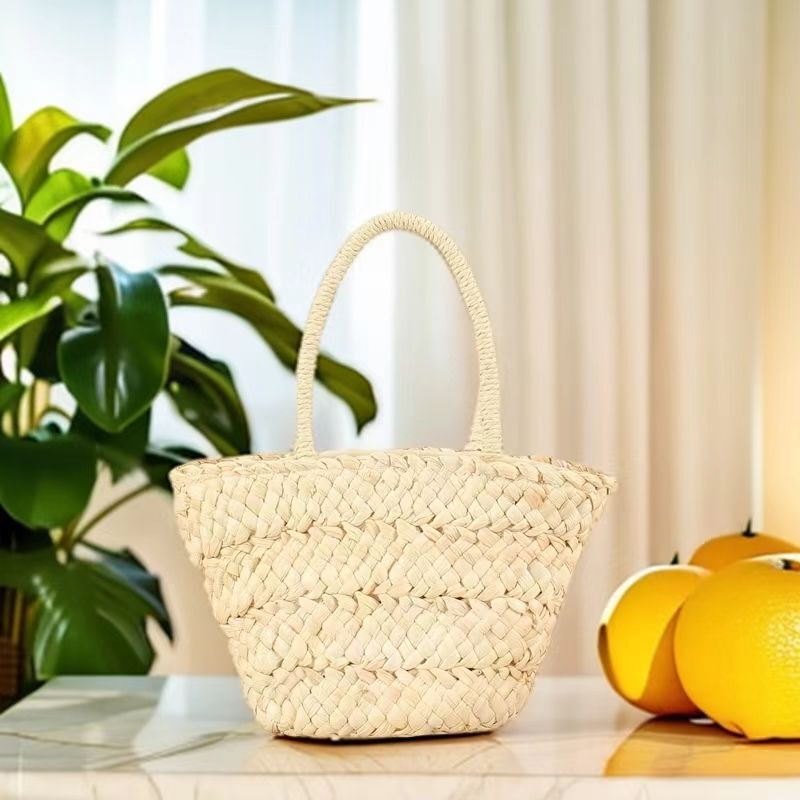 On behalf of the hair wholesale cute corn leather hand carrying straw woven bag new portable straw bag women's beach holiday beach