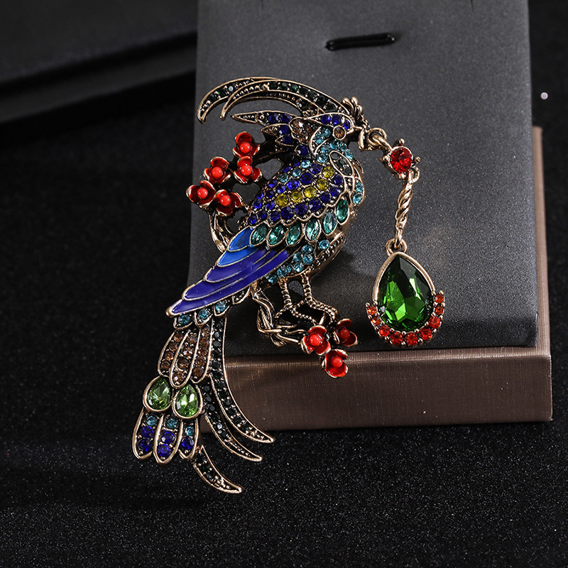 Retro colored diamond bird beautiful water drop pendant phoenix peacock European and American popular animal corsage clothing accessories wholesale