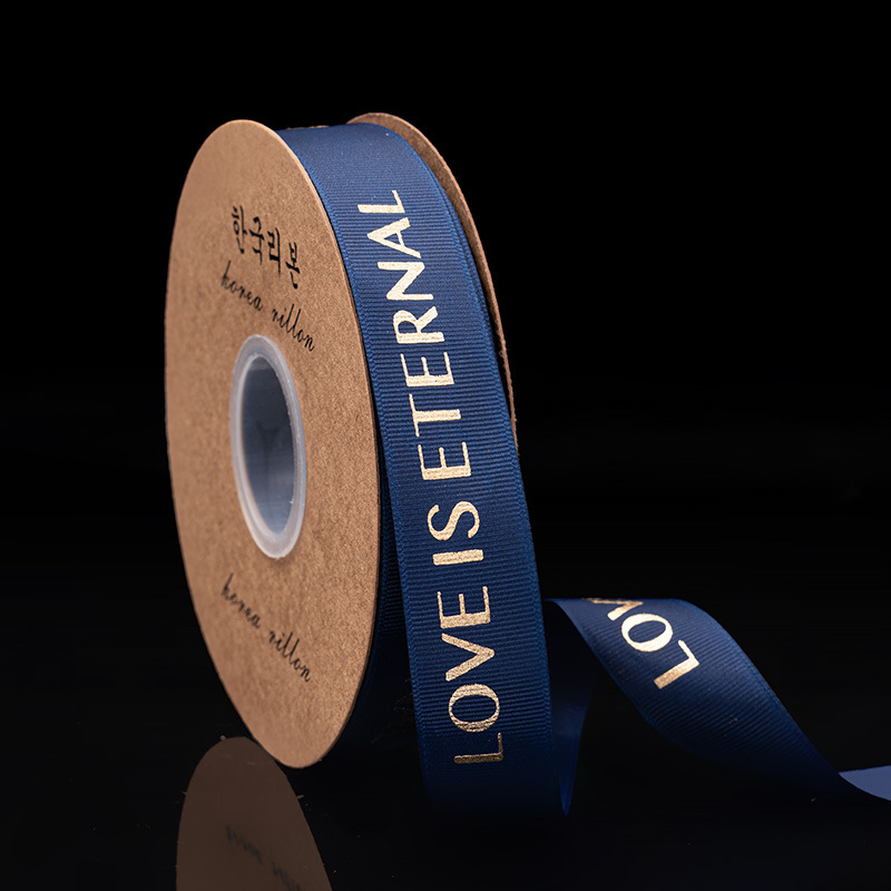 2,5 cm dorado cinta tienda de flores material de DIY floral al por mayor de la flor de poliéster Inglés carta envuelta cinta de la flor