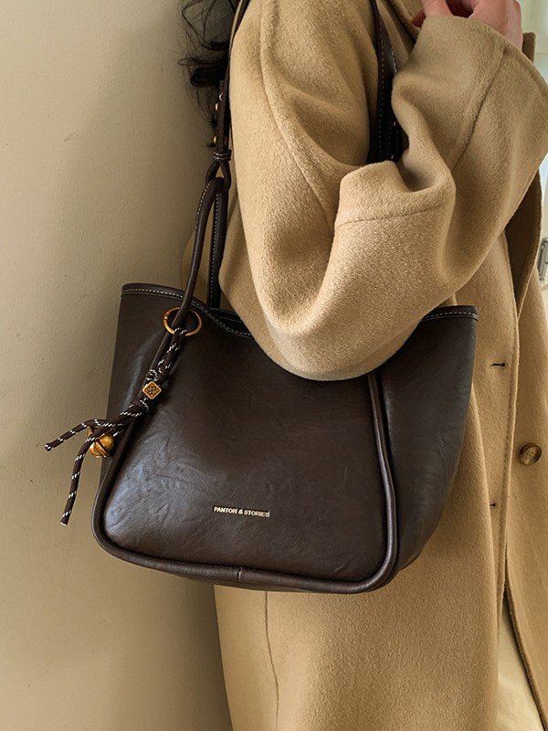 Bolso de mujer venta caliente nuevo nicho coreano bolso de cubo de alta capacidad de sensación universal bolso de moda para niños bolso de hombro