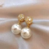 Golden pendant with zircon pearl, earrings
