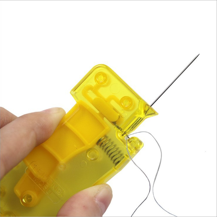 Yellow threader with spring needle threa...