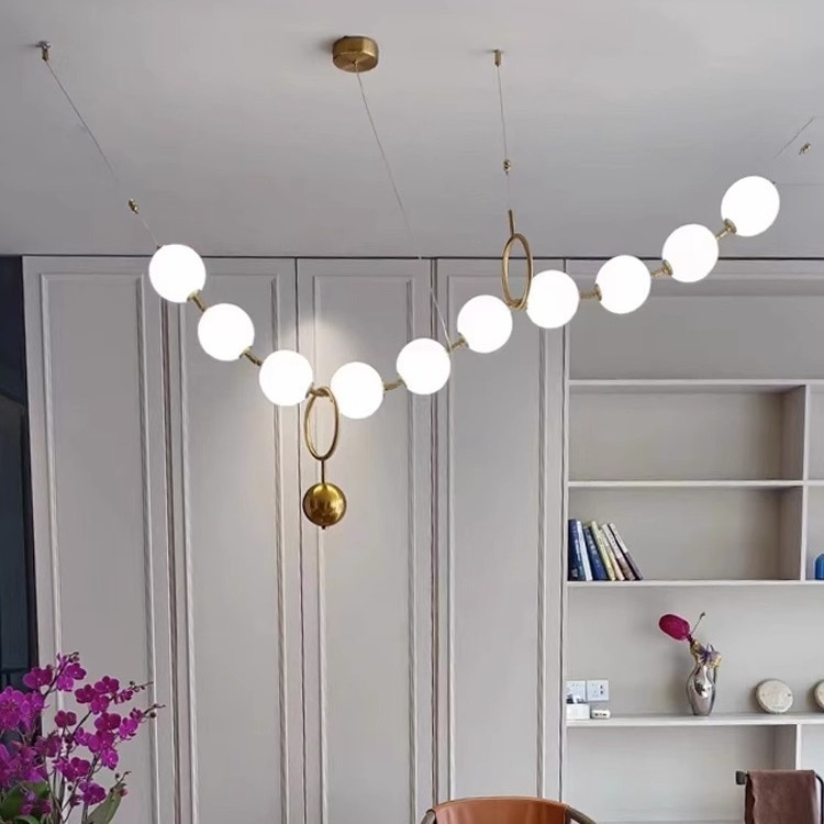 Luz francesa del restaurante de frijoles mágicos moderno simple bronce collar de perlas lámpara de bar largo loft Buda perlas lámpara de bar