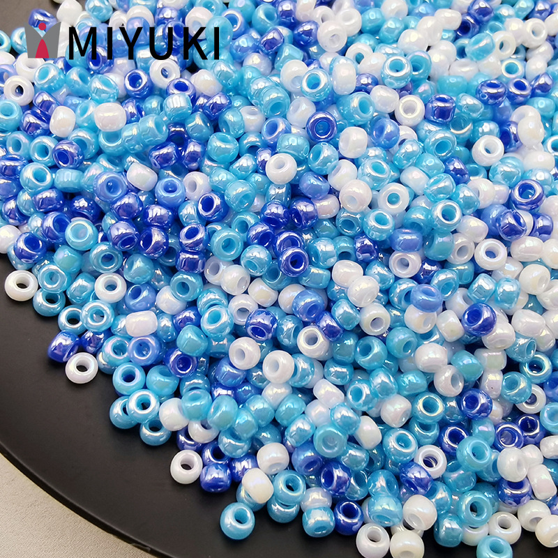 MIYUKI Yuki Japón importación de 2mm de alto brillo esmalte de vidrio de color arroz cuentas hechas a mano DIY material de collar de pulseras de cuentas